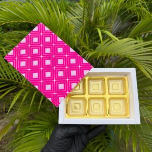 6-Piece Chocolate Box with Vibrant Pink Geometric Sleeve & Golden Cavity Tray   Color: Hot Pink & Soft Pink Geometric Grid Pattern with Metallic Gold Inner Tray