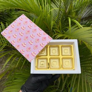 6-Piece Chocolate Box with Blush Pink Floral Damask Sleeve & Golden Cavity Tray   Color: Blush Pink with Red & Gold Floral Damask Motif & Metallic Gold Inner Tray