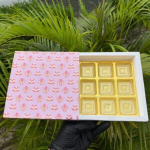 9-Piece Chocolate Box with Blush Pink Floral Damask Sleeve & Golden Cavity Tray   Color: Blush Pink with Pink & Yellow Floral Damask Motif & Metallic Gold Inner Tray
