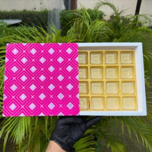 16-Piece Chocolate Box with Vibrant Pink Geometric Sleeve & Golden Cavity Tray   Color: Hot Pink & Soft Pink Geometric Grid Pattern with Metallic Gold Inner Tray