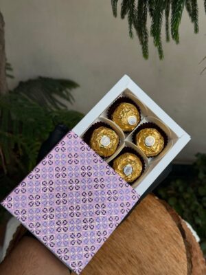 4-Piece Chocolate Box with Lavender Floral Tile Patterned Sleeve   Color: Soft Pink & Pastel Purple Floral Tile Pattern