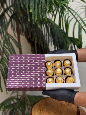 9-Piece Chocolate Box with Royal Purple Golden Foil Leaf Pattern Sleeve   Color: Deep Plum / Royal Purple with Metallic Golden Foil Accent